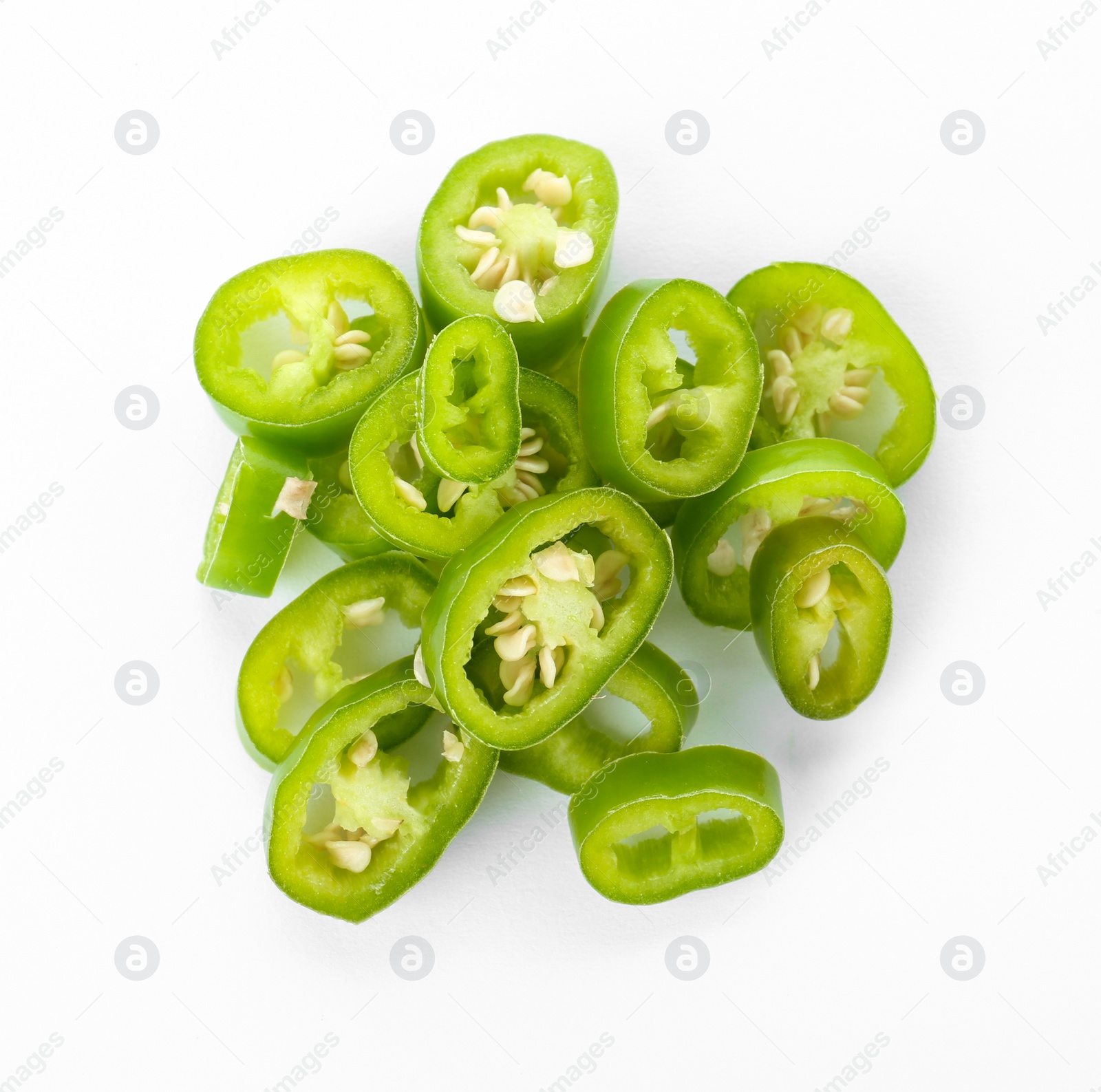 Photo of Pile of cut chili peppers on white background, top view