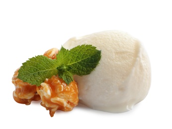 Scoop of delicious ice cream with mint and caramel popcorn on white background