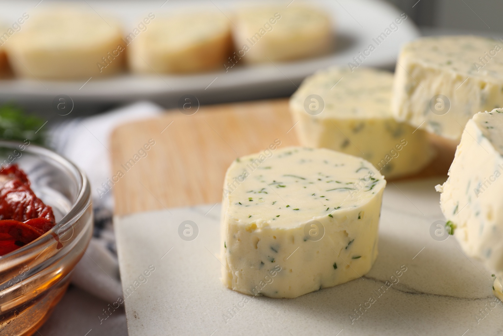 Photo of Tasty butter with dill on table, closeup