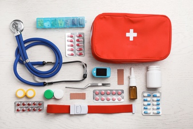 Flat lay composition with medical objects on white wooden background