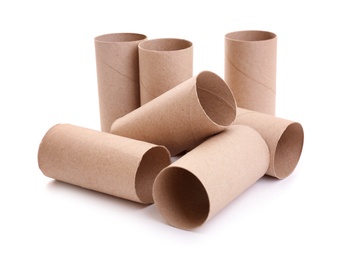 Photo of Empty paper toilet rolls on white background