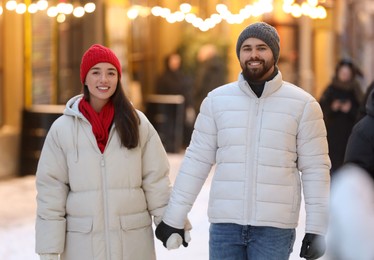 Lovely couple spending time together on city street