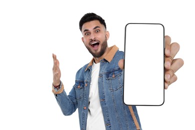 Image of Happy man holding smartphone with empty screen on white background