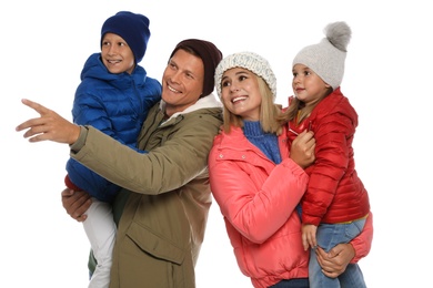 Photo of Happy family with children in warm clothes on white background. Winter season