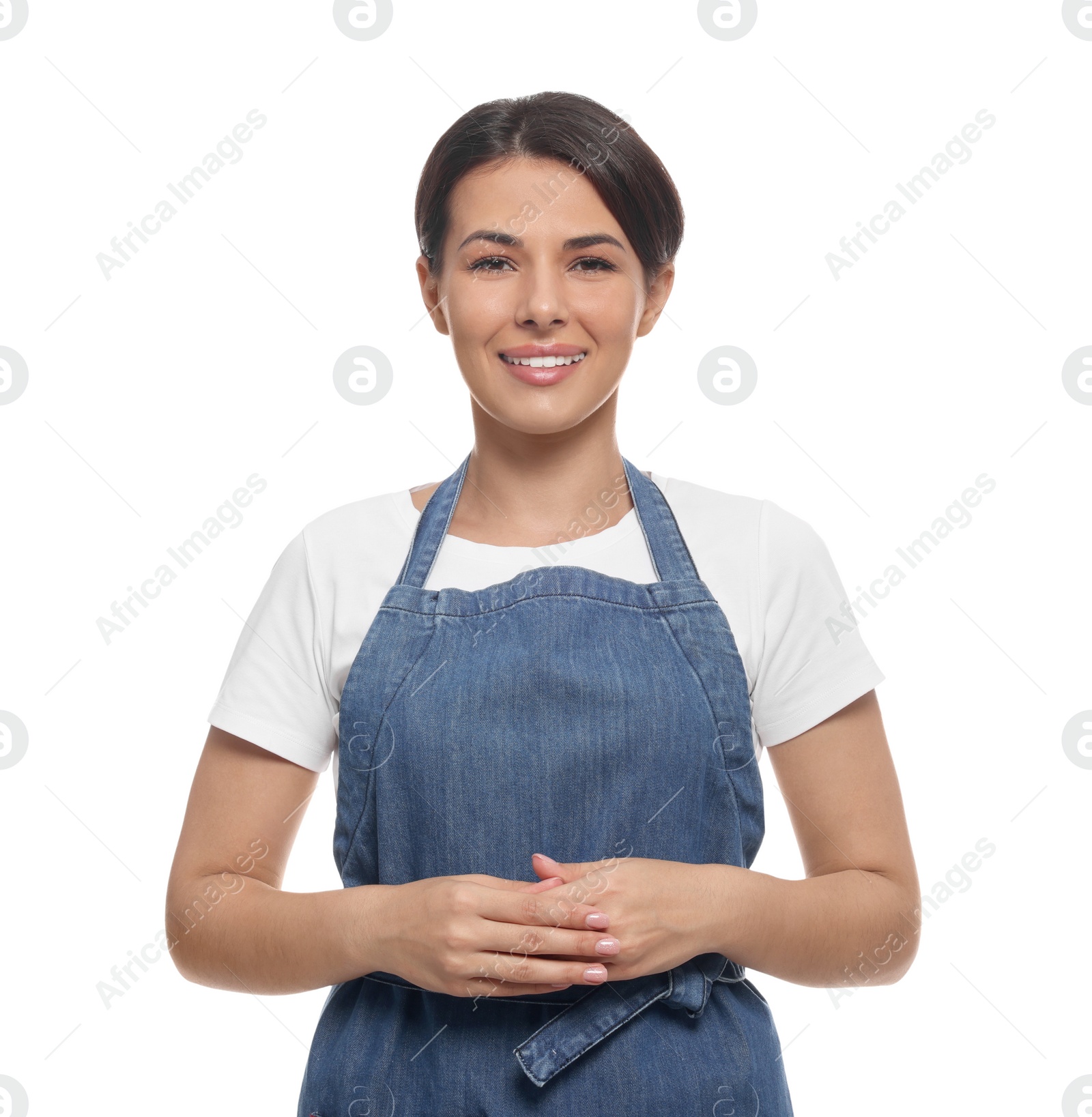 Photo of Young woman in blue apron on white background