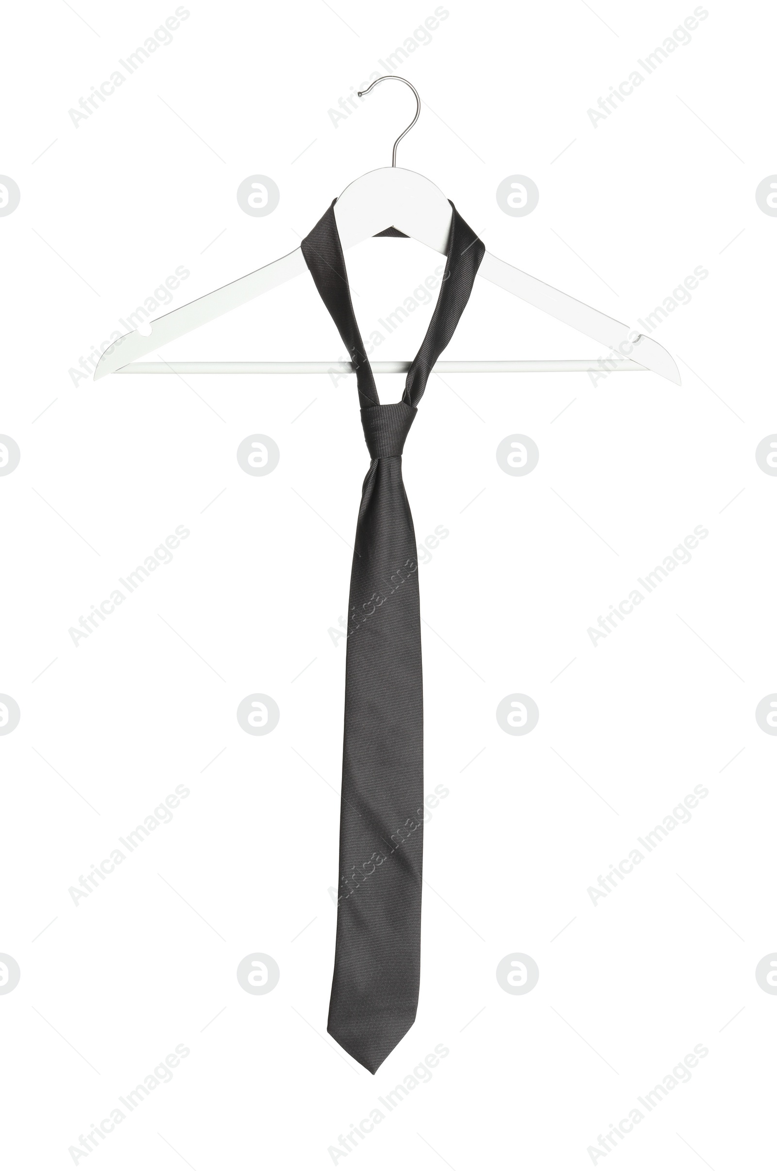 Photo of Hanger with grey necktie isolated on white