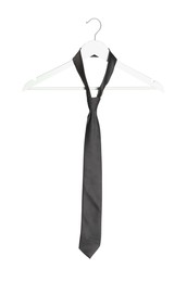 Photo of Hanger with grey necktie isolated on white