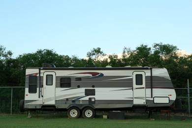 Photo of Travel trailer parked outdoors. Home on wheels