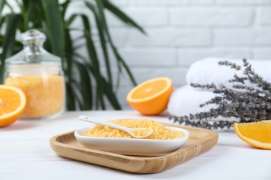 Photo of Sea salt, lavender, orange and towels on white wooden table