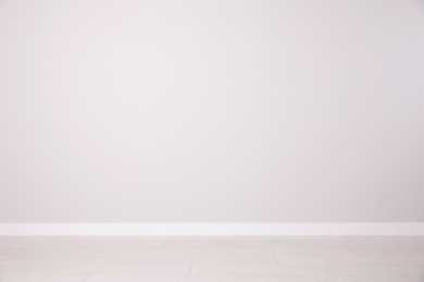 Photo of Blank white wall in room. Space for design