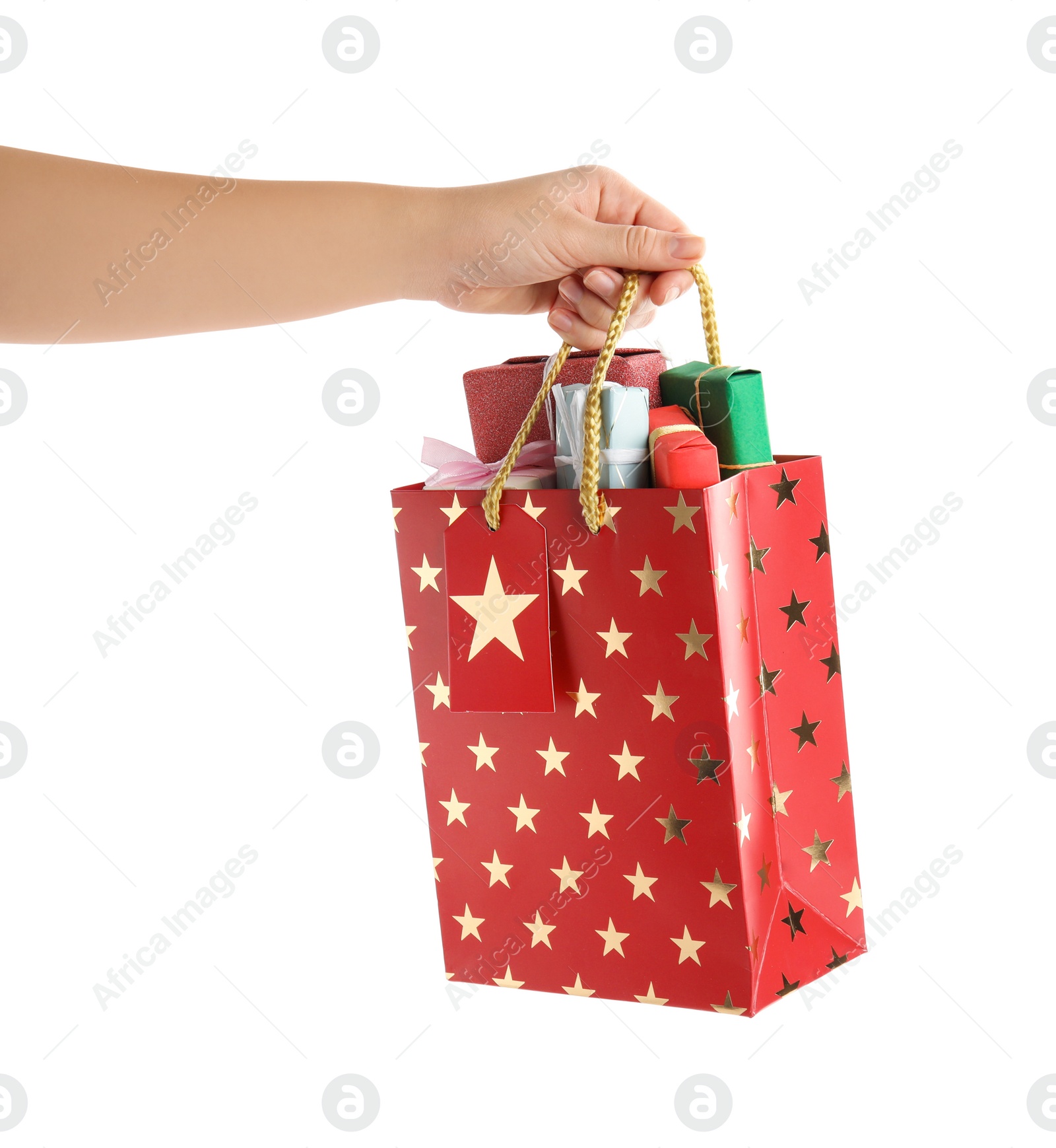 Photo of Woman holding shopping paper bag with presents on white background, closeup