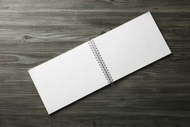 Blank paper brochure on wooden table, top view. Mockup for design