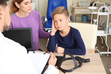 Woman with her child visiting doctor in hospital