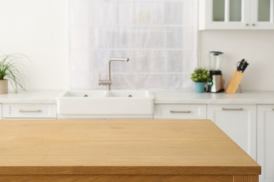 Stylish wooden table in kitchen. Interior design