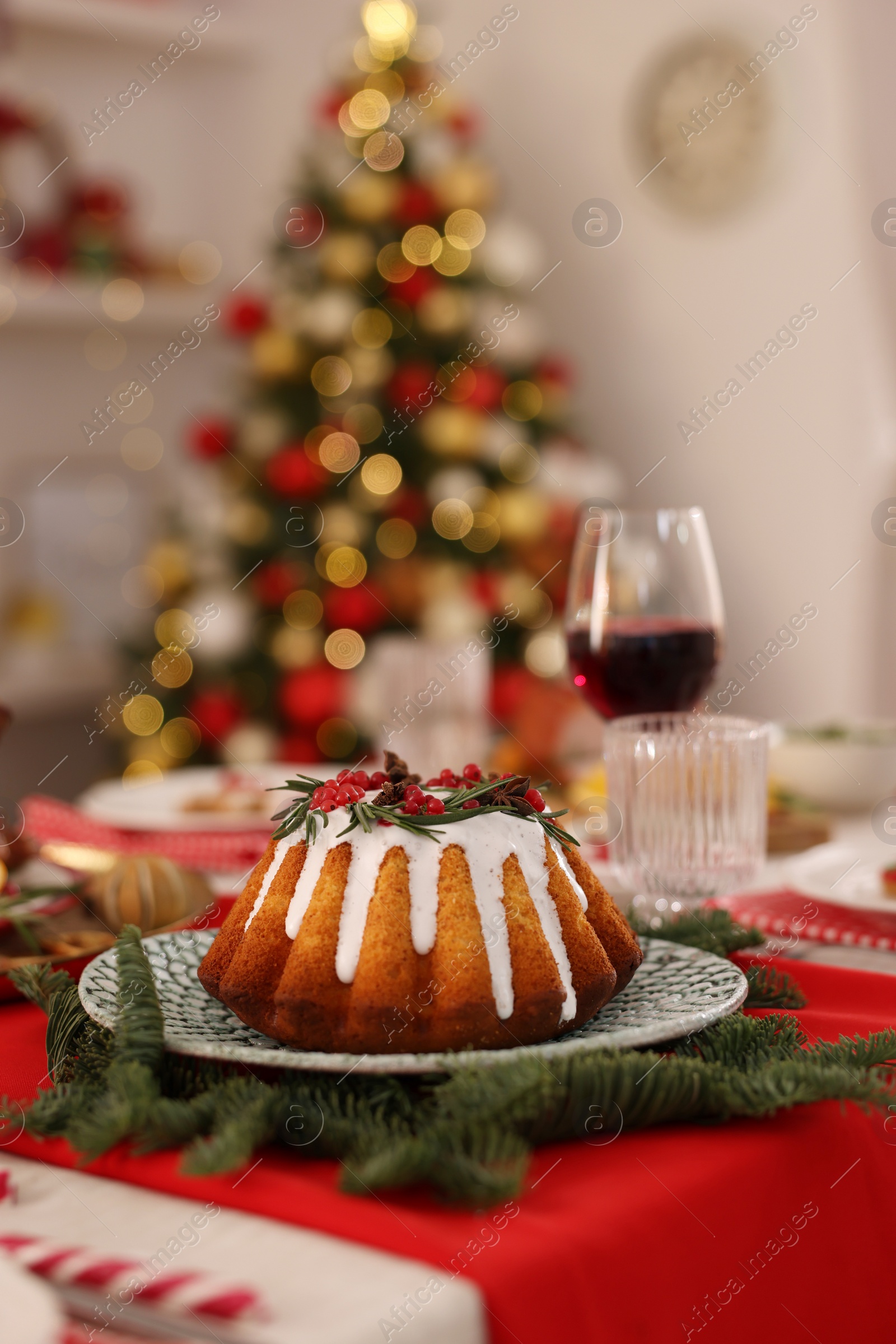Photo of Festive dinner with delicious cake served on table indoors, space for text. Christmas Eve celebration