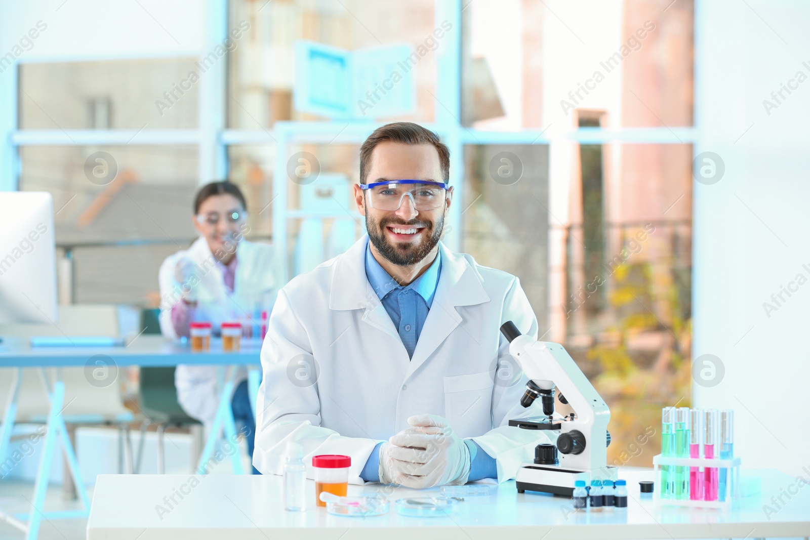 Photo of Young scientist working in laboratory. Chemical analysis