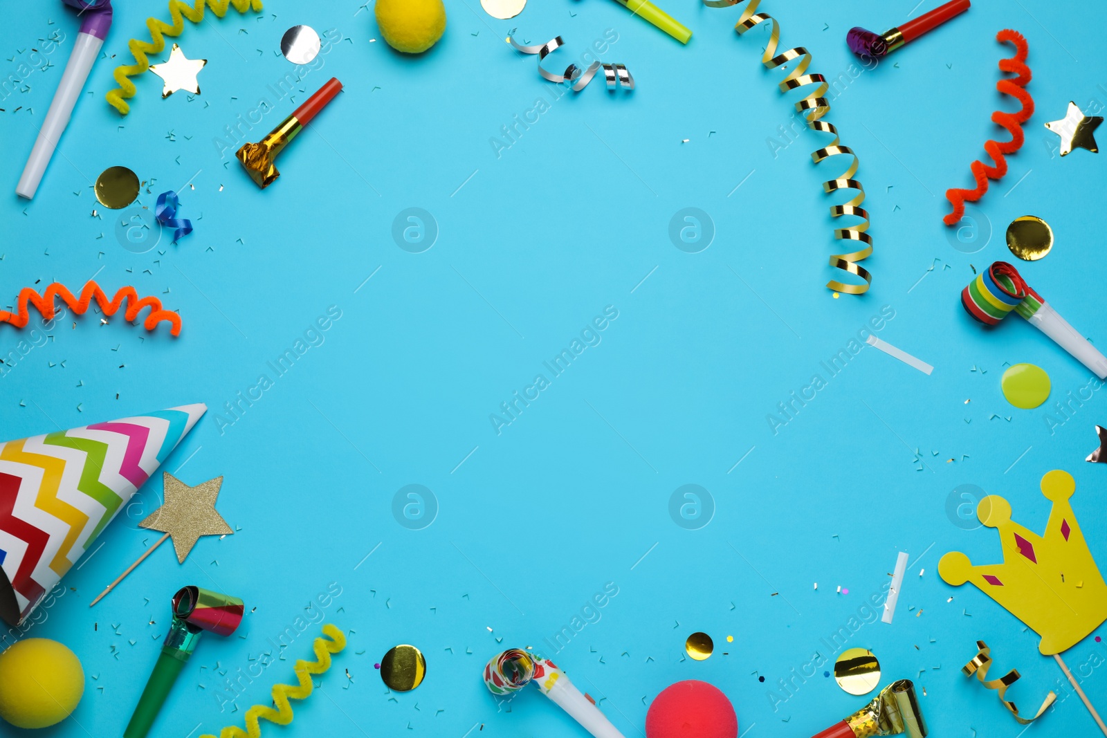 Photo of Frame of party items and confetti on light blue background, flat lay. Space for text
