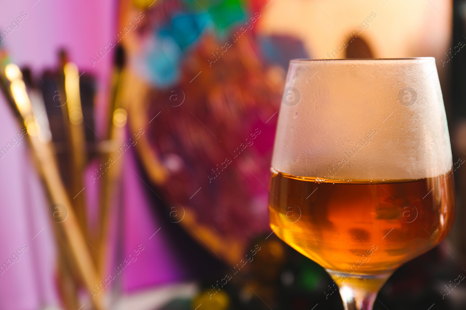 Photo of Glass of tasty wine on colorful background, closeup. Space for text