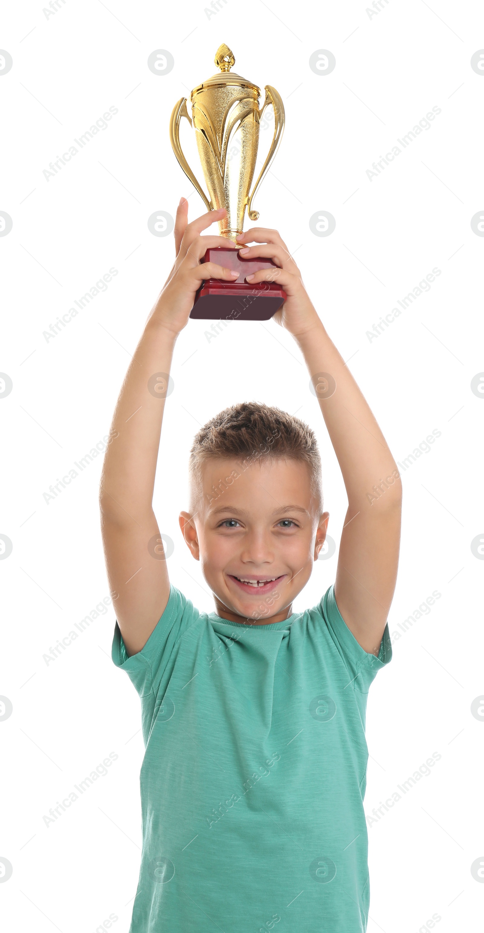 Photo of Happy boy with golden winning cup isolated on white