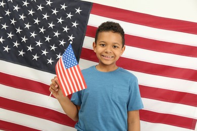 Happy African American boy with national flags