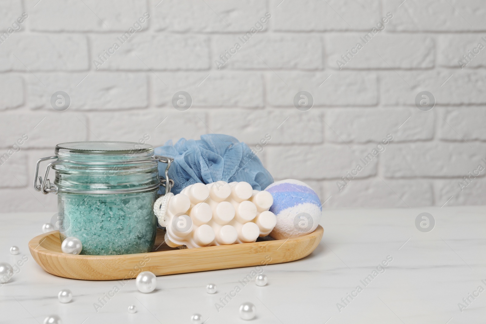 Photo of Spa gift set on white marble table. Space for text