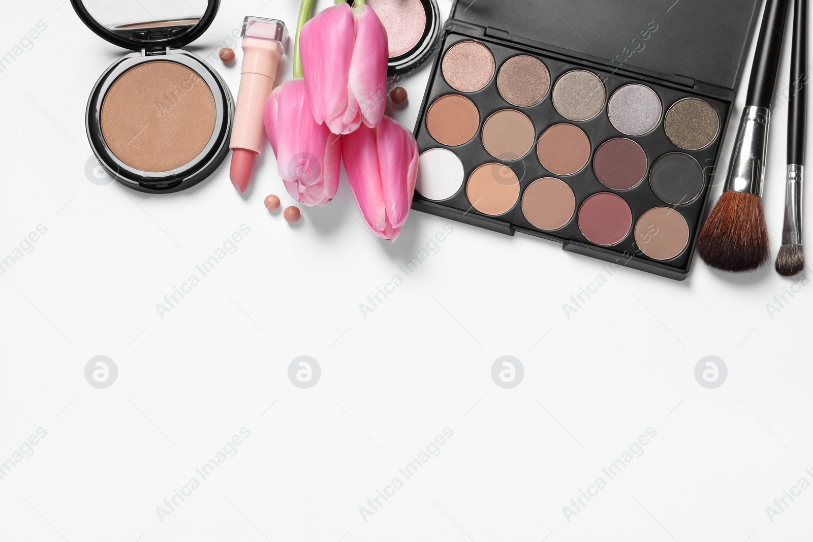 Photo of Flat lay composition with eyeshadow palette and beautiful tulips on white background, space for text