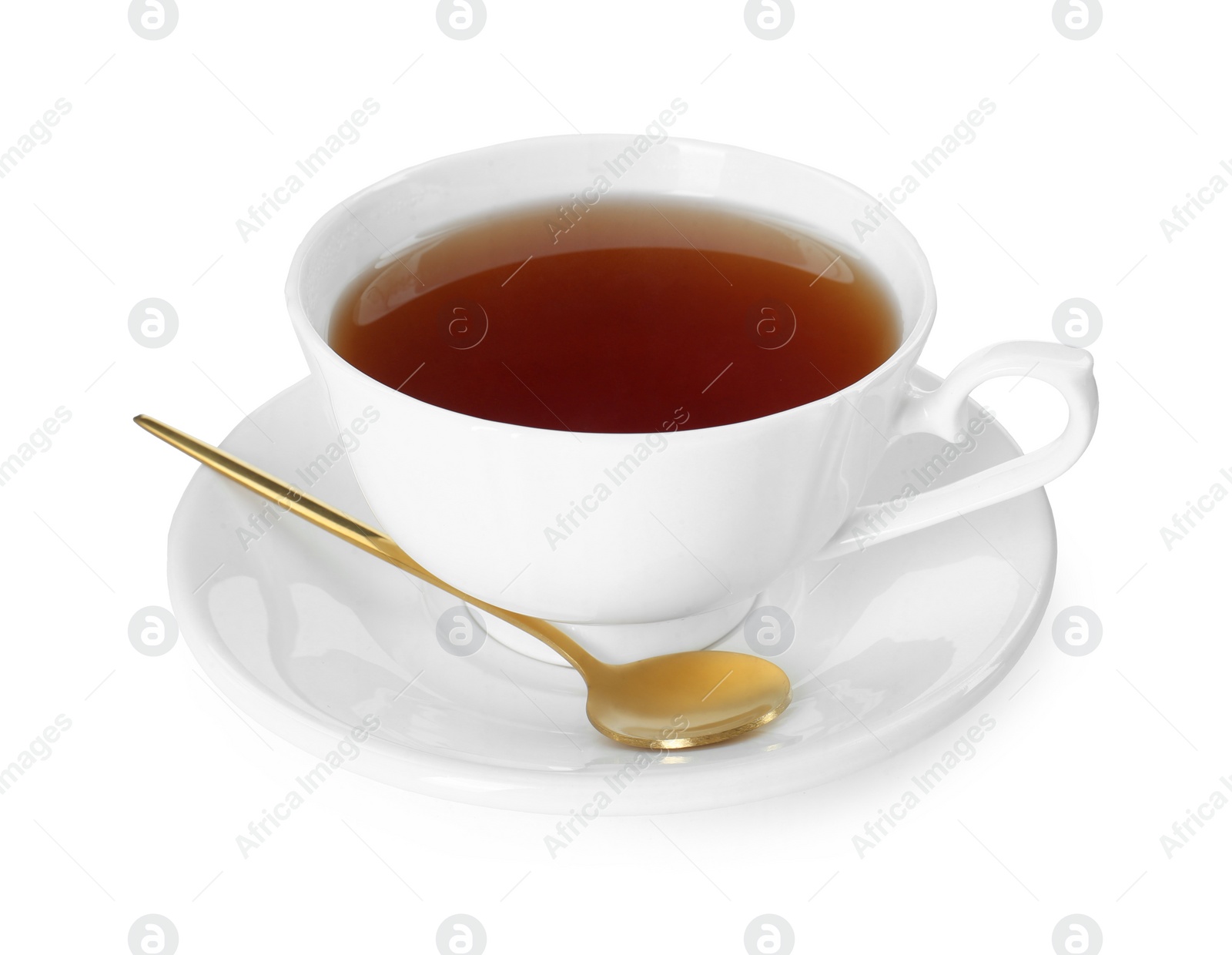 Photo of Aromatic tea in cup and golden spoon isolated on white