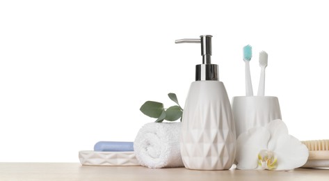 Bath accessories. Different personal care products and flower on wooden table against white background. Space for text