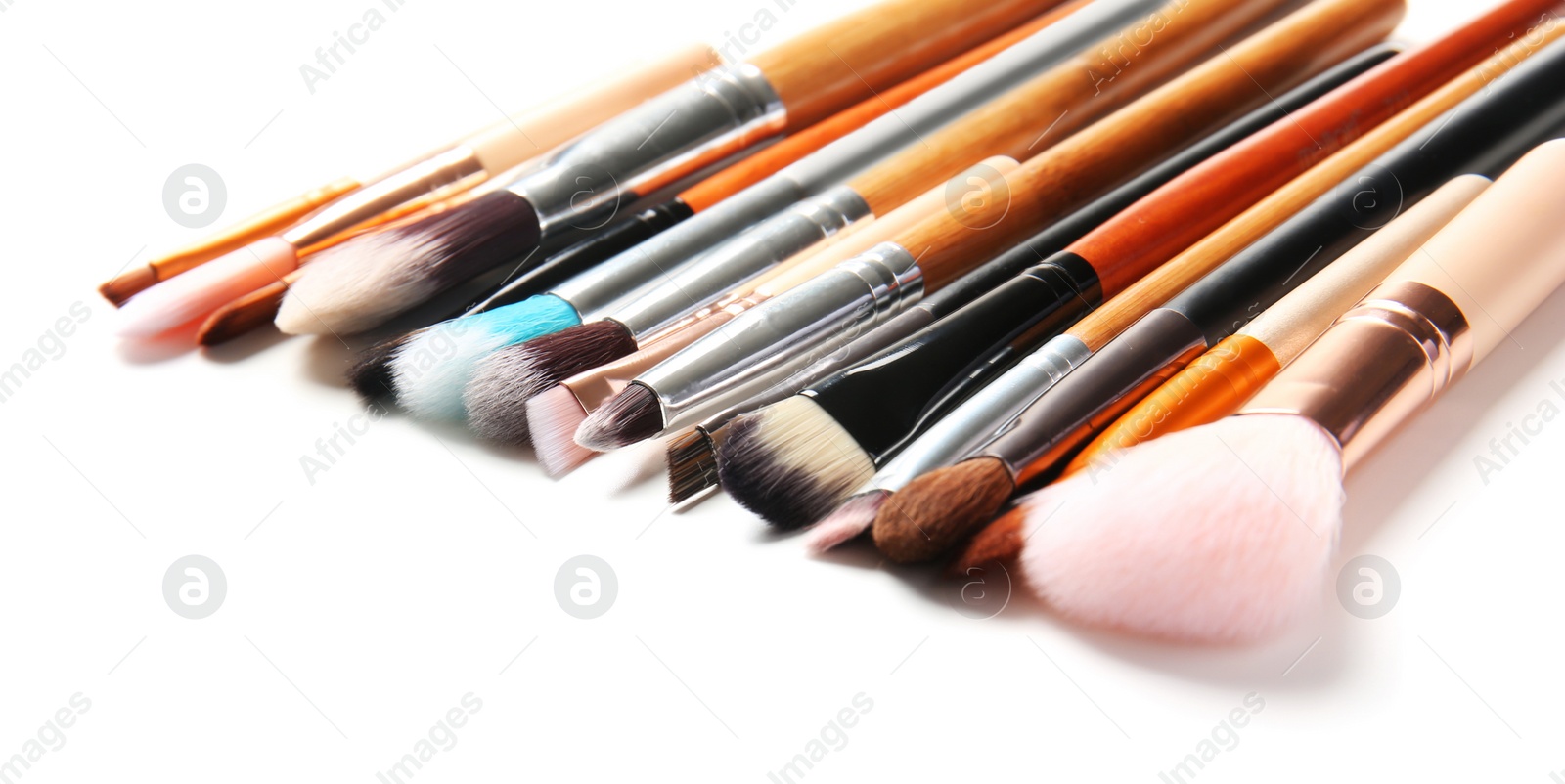 Photo of Makeup brushes of professional artist on white background