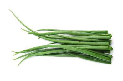 Photo of Fresh green spring onions isolated on white, top view