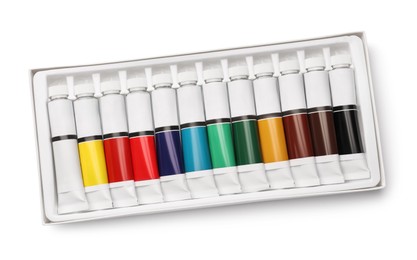 Set of colorful oil paints in tubes on white background, top view