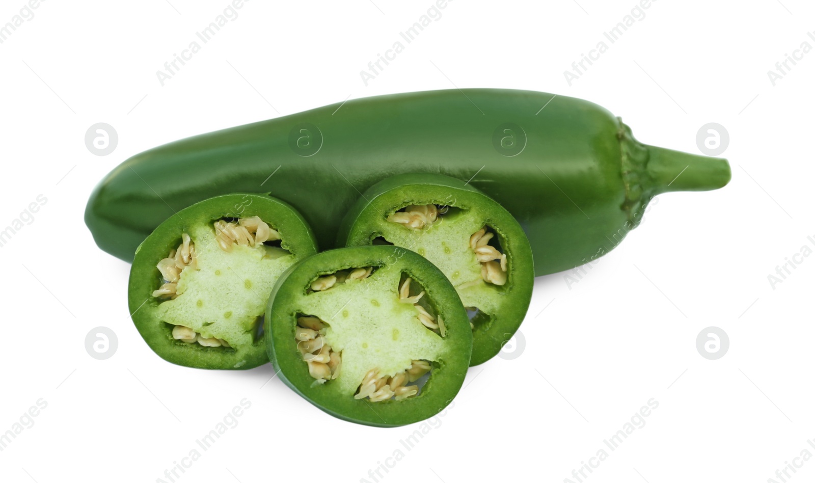 Photo of Whole and cut green hot chili peppers isolated on white