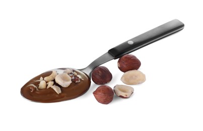 Photo of Spoon with delicious chocolate paste and hazelnuts on white background