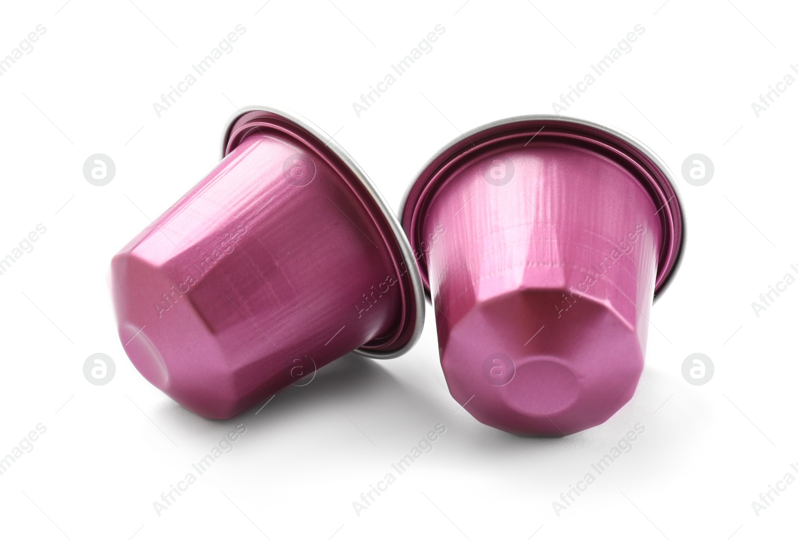 Photo of Two plastic coffee capsules isolated on white