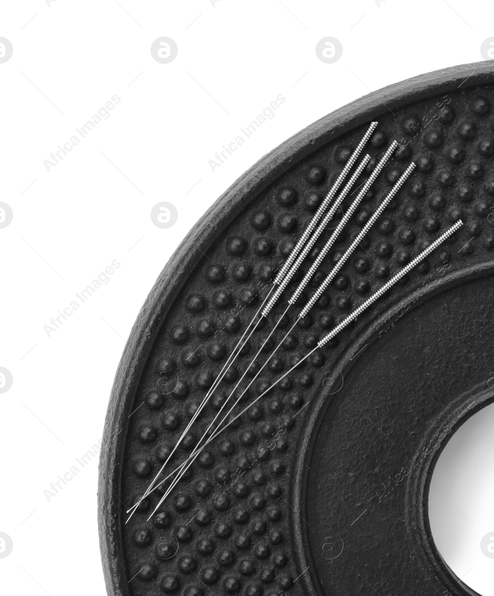 Photo of Plate with acupuncture needles on white background