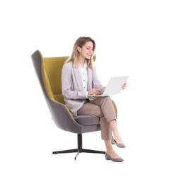 Photo of Young businesswoman with laptop sitting in armchair on white background