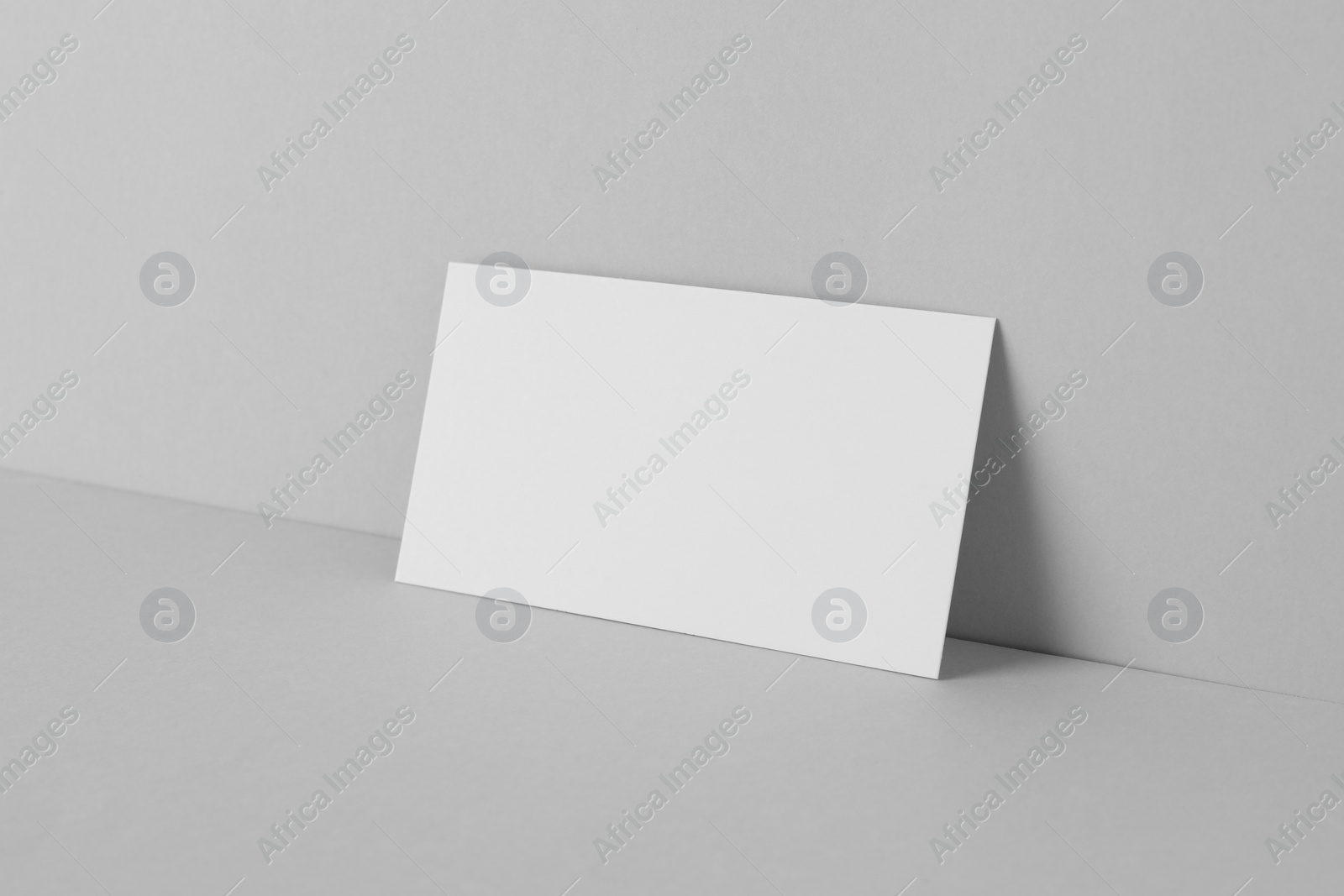 Photo of Blank business card on light grey background. Mockup for design