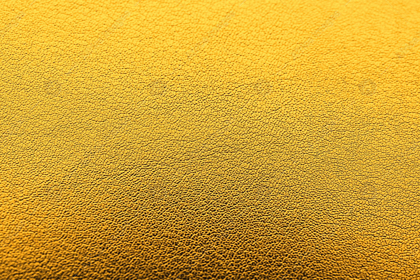 Image of Golden textured surface as background, closeup view