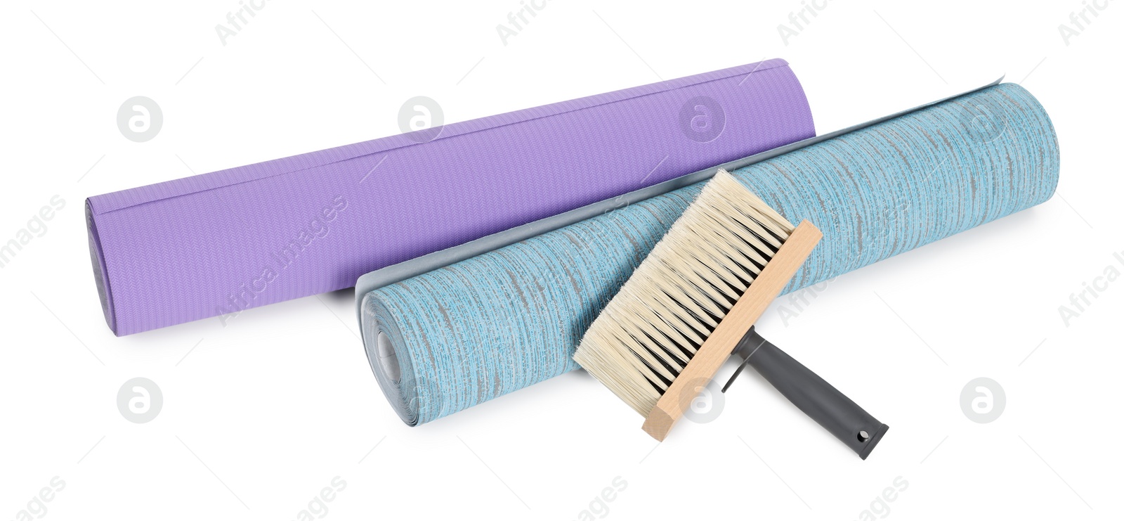 Photo of Wallpaper rolls and brush isolated on white