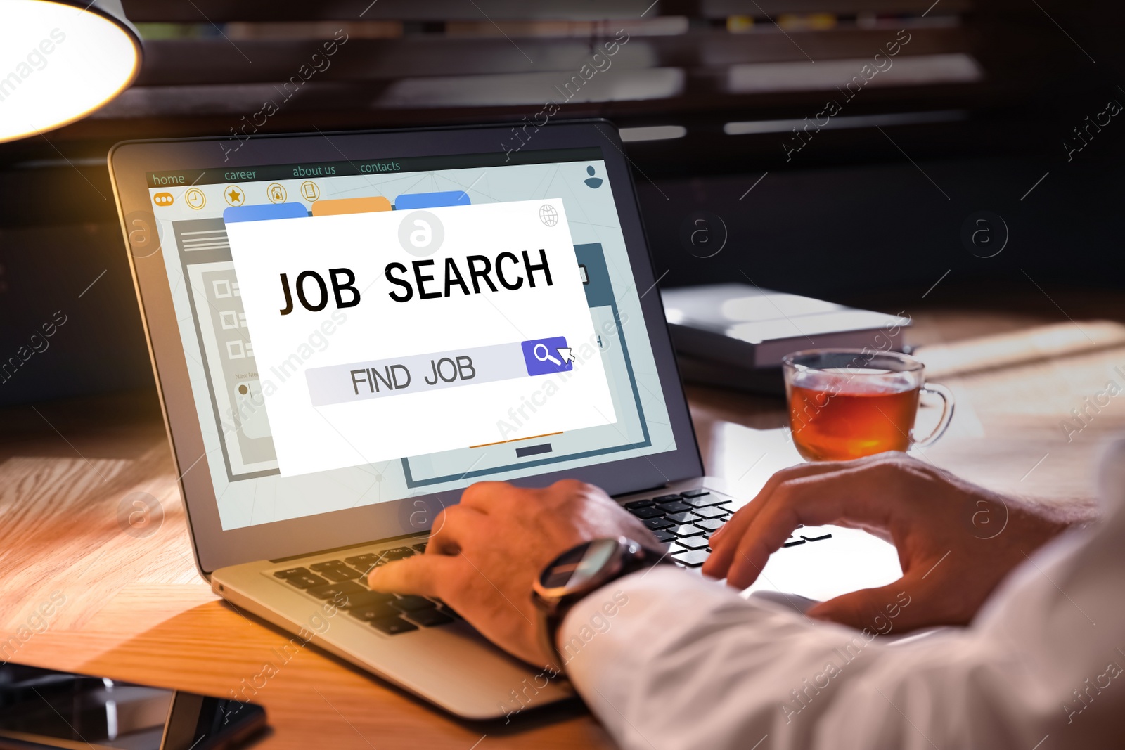 Image of Man working with modern laptop at wooden table indoors, closeup. Job search