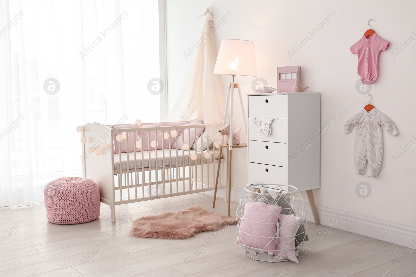 Photo of Interior of baby room with comfortable crib