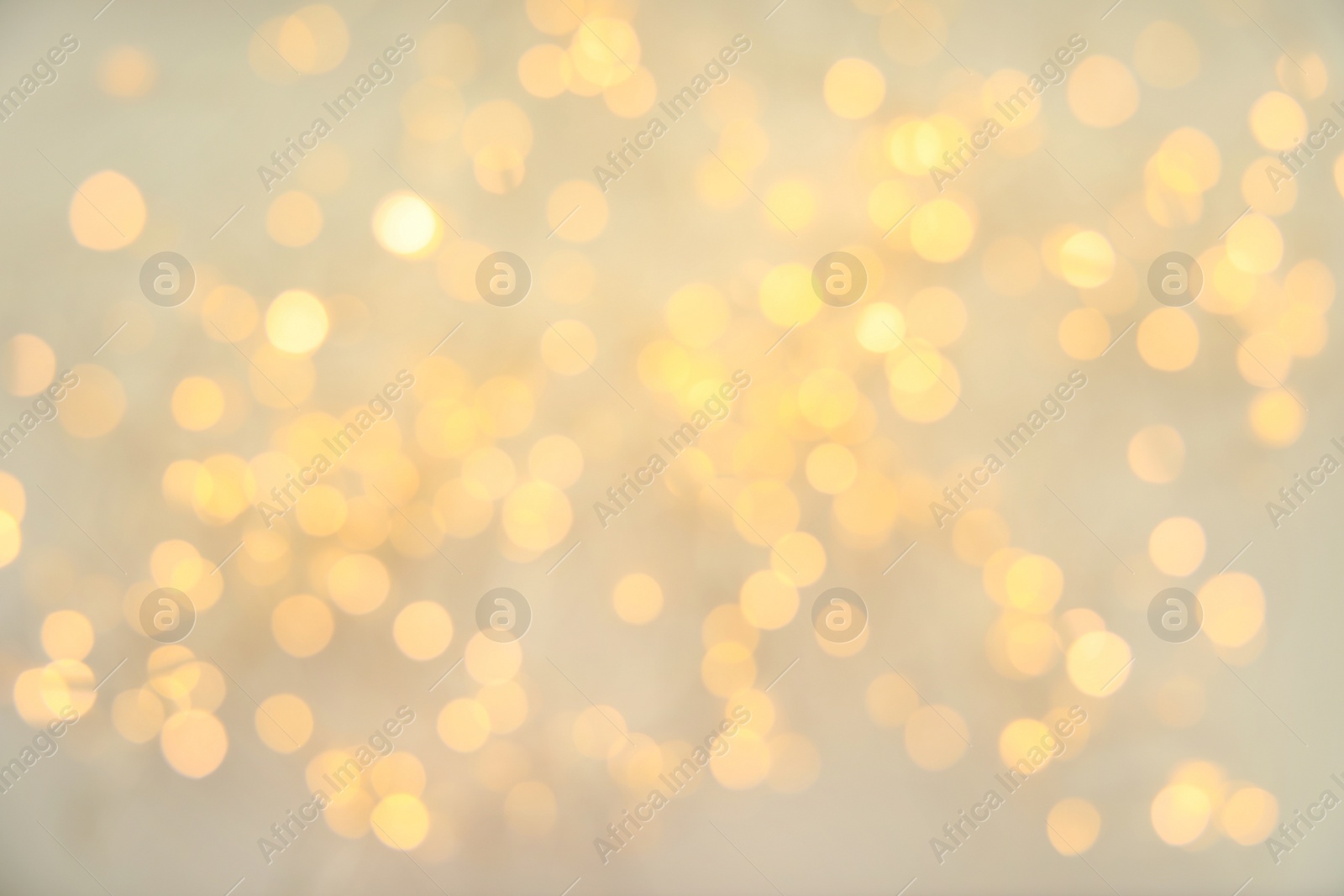 Photo of Gold glitter with bokeh effect on light background