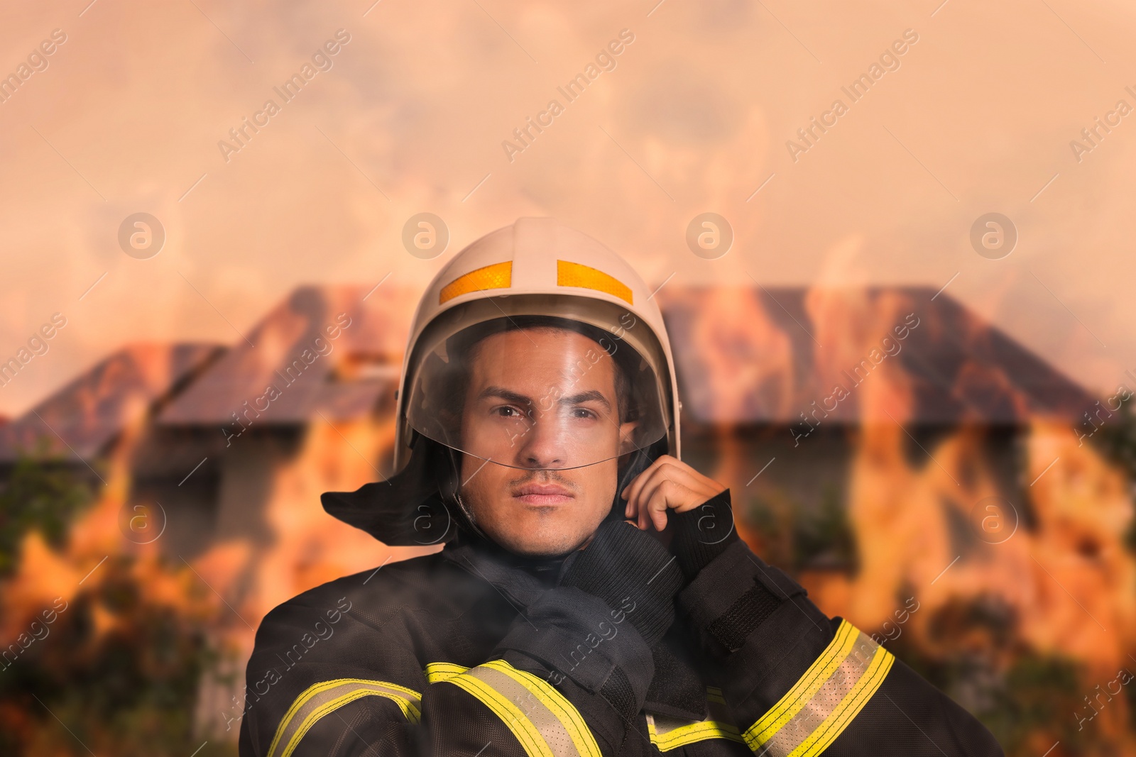 Image of Rescuer wearing uniform and helmet. Professional firefighter