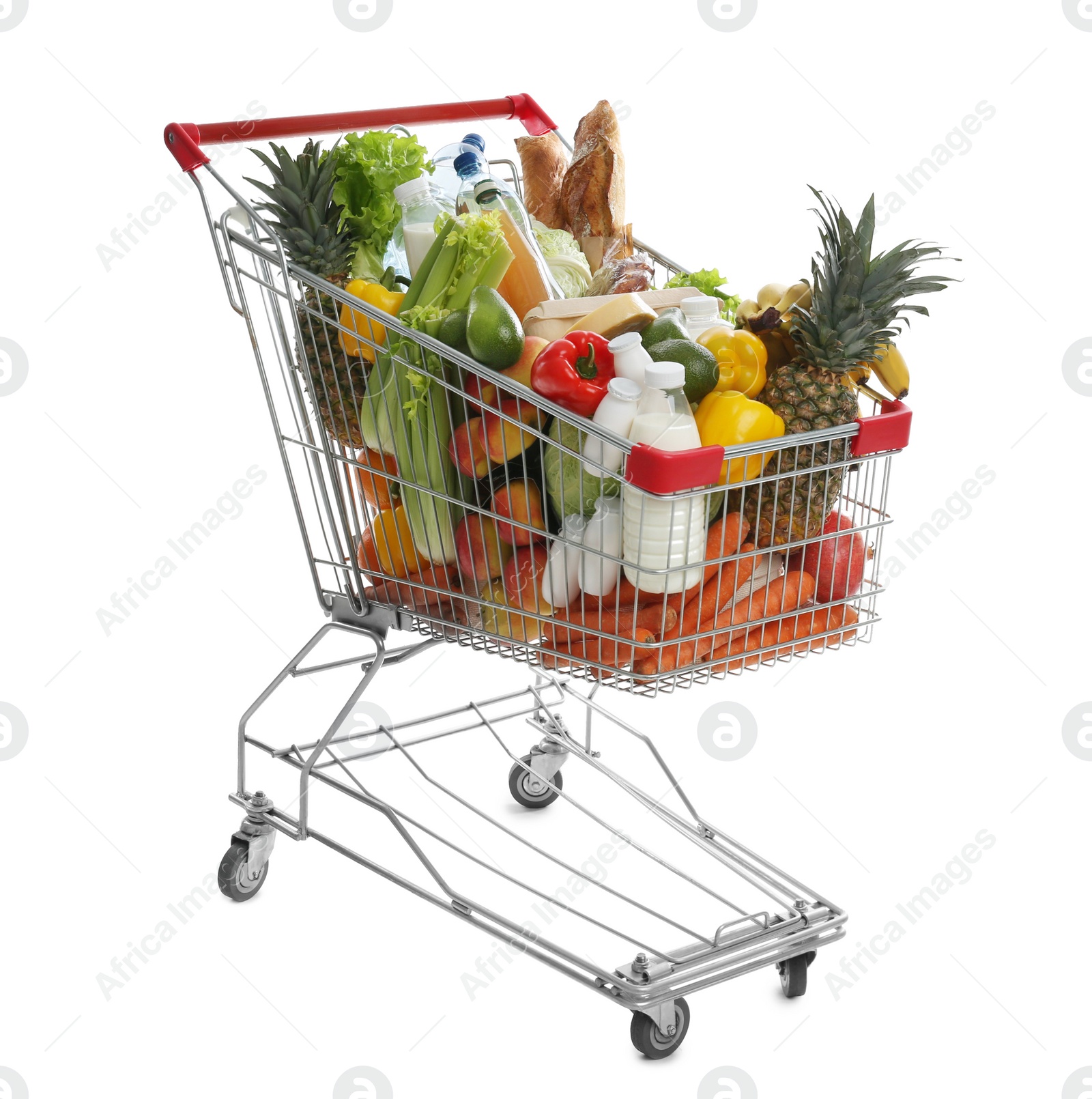 Photo of Shopping cart with groceries on white background