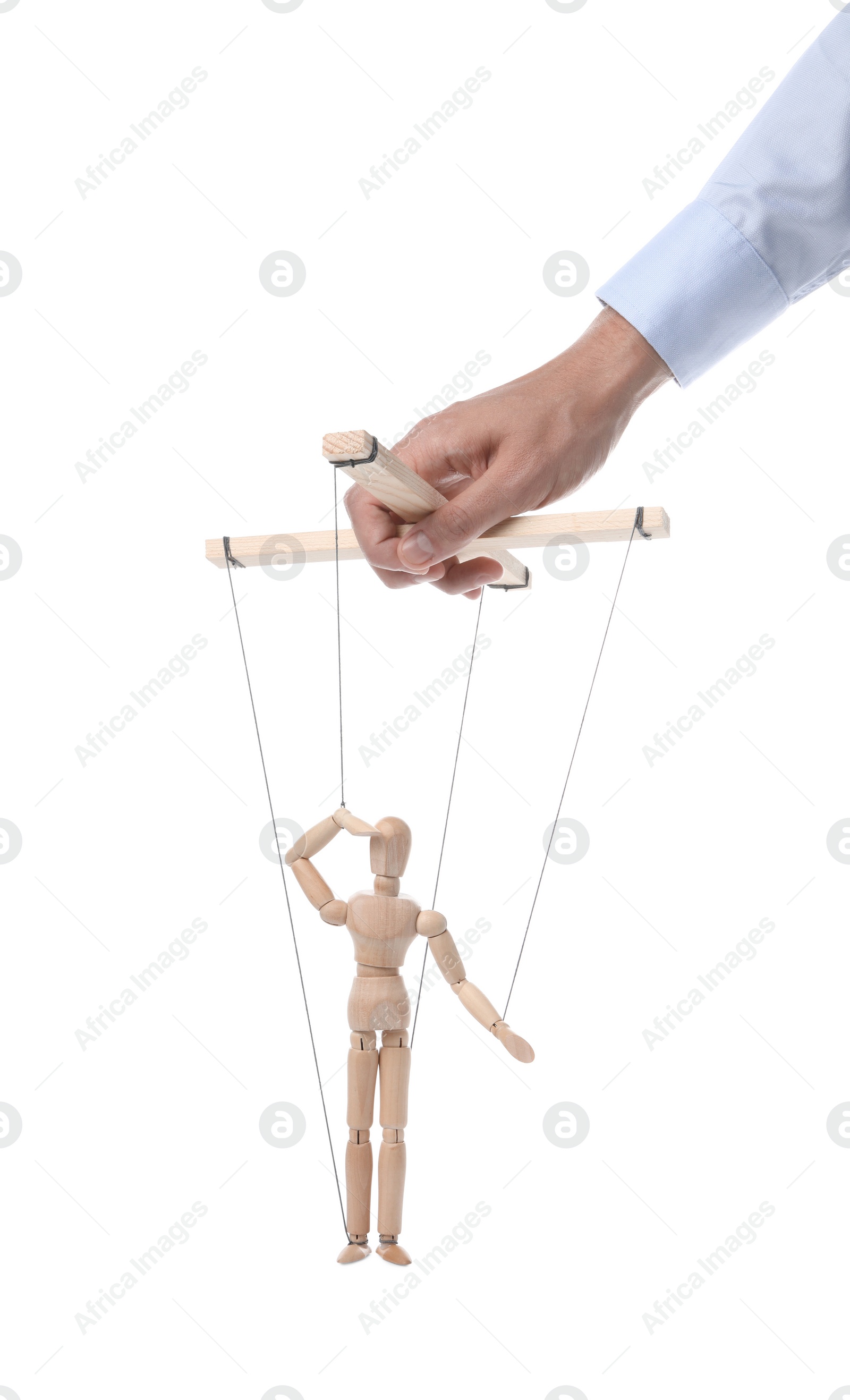 Photo of Man pulling strings of puppet on white background, closeup