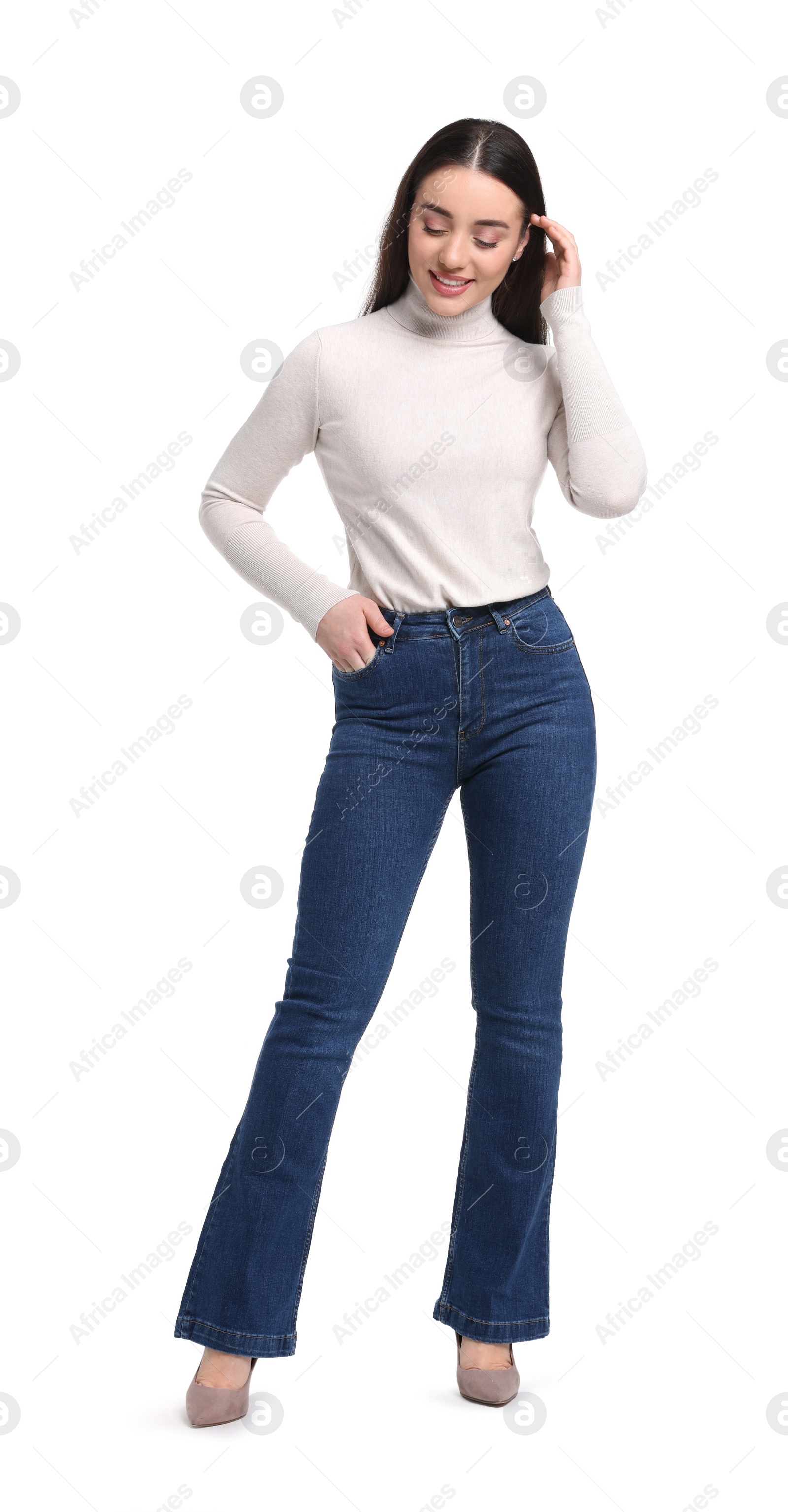 Photo of Young woman in stylish jeans on white background