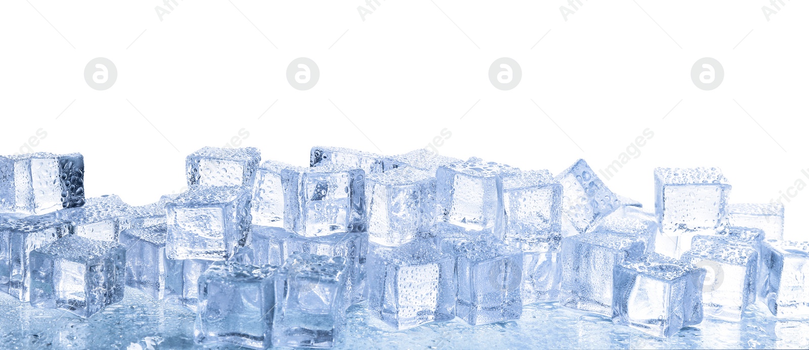 Photo of Crystal clear ice cubes with water drops isolated on white