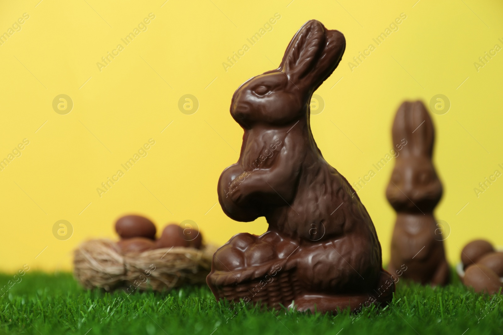 Photo of Delicious chocolate Easter bunny on green grass