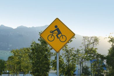 Road sign with cycle route on city street