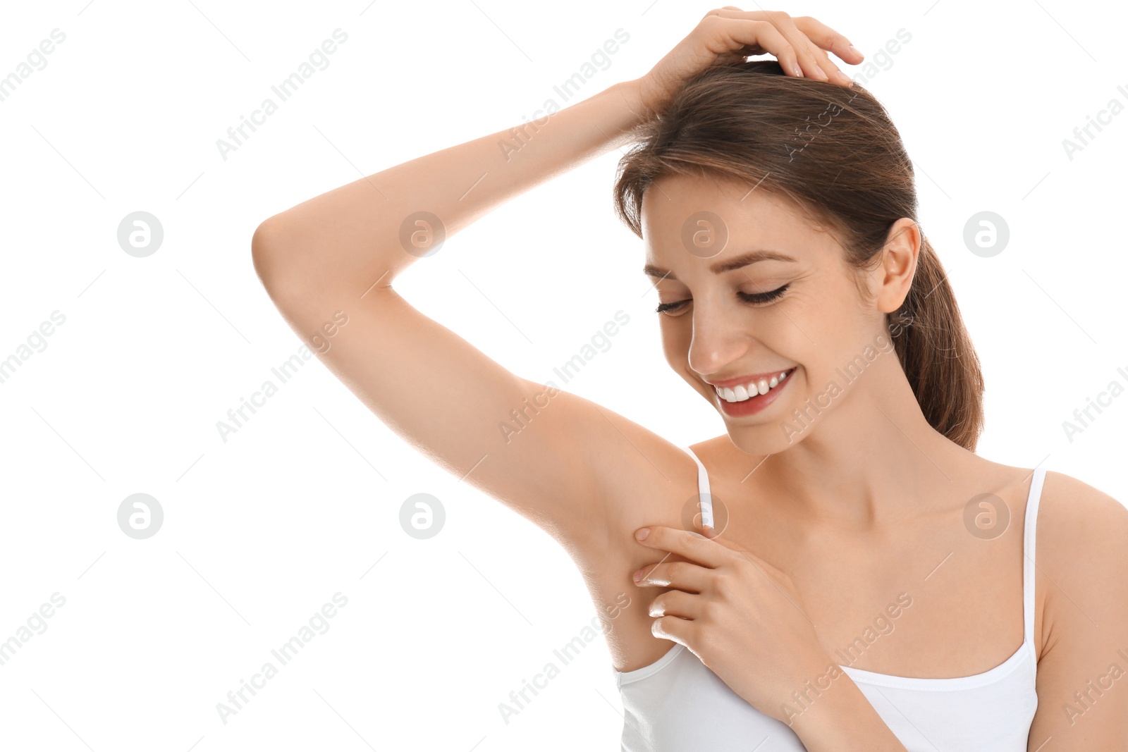 Photo of Young woman showing armpit with smooth clean skin on white background